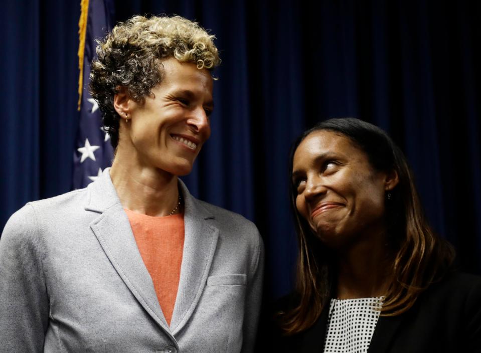  Cosby accuser Andrea Constand, left, smiles with prosecutor Kristen Fenden following the sentencing