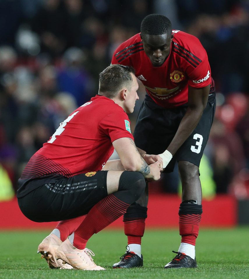  Eric Bailly consoles Phil Jones after his missed spot-kick