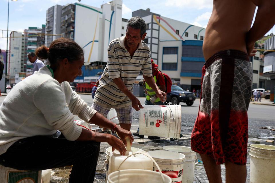  The mum-of-two has had to queue for an hour for drinking water at the pipe