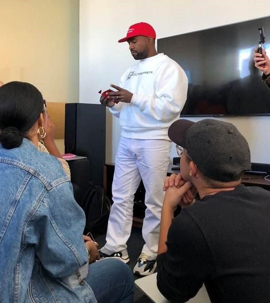 Kanye West made a strange fashion statement by wearing a Donald Trump cap and Colin Kaepernick jumper today