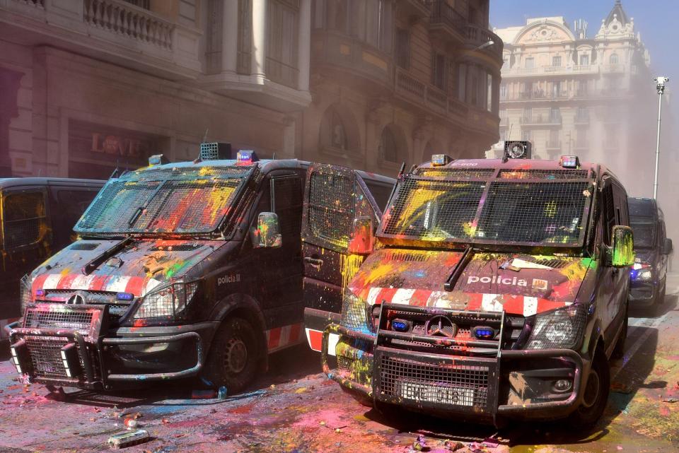  Police vans were covered in paint