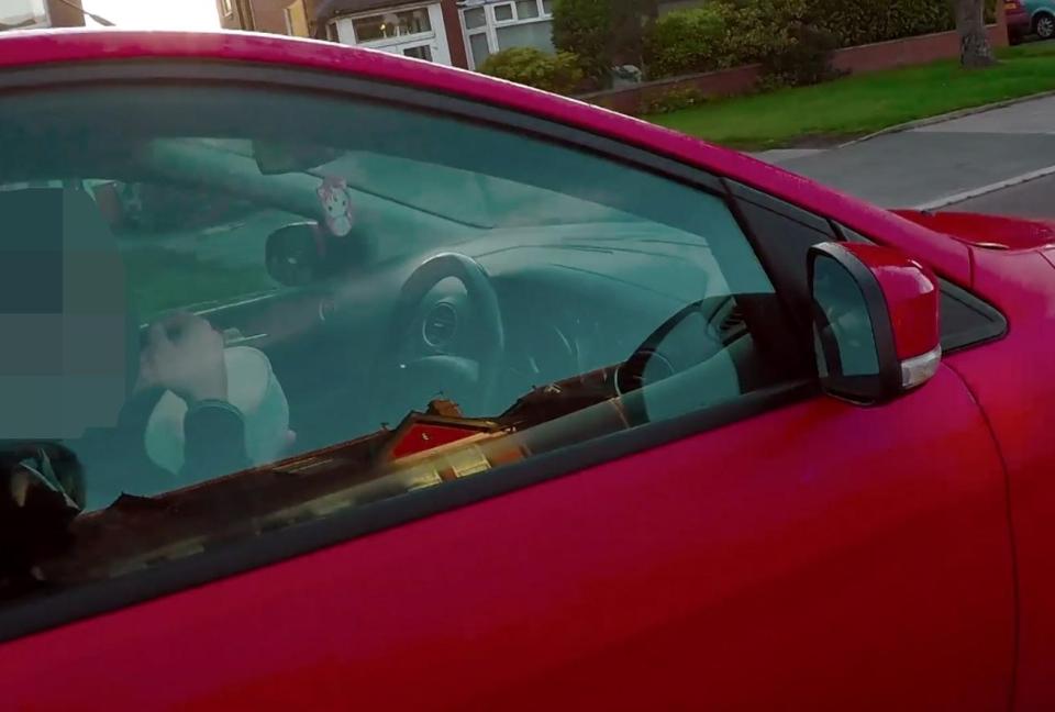  The driver is spotted spooning mouthfuls of cereal into his mouth from a large bowl