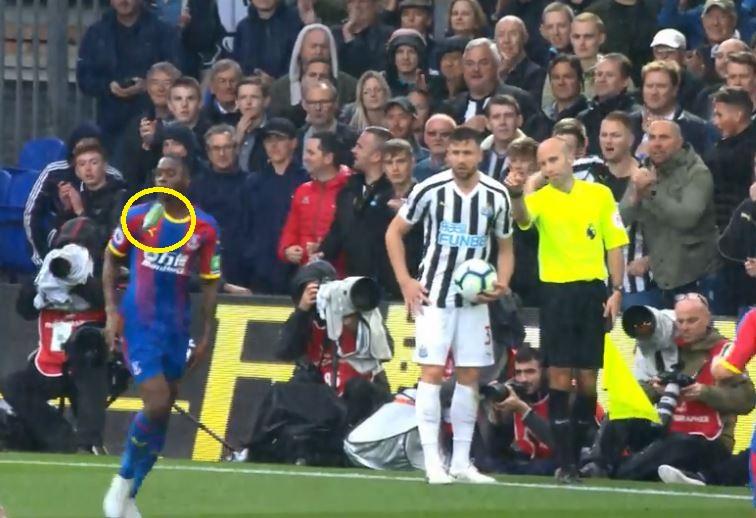  Aaron Wan-Bissaka is struck by a beer bottle thrown by a Newcastle fan