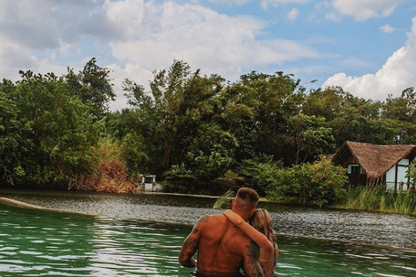  They later stripped to their swimwear for a dip in the gardens' lake