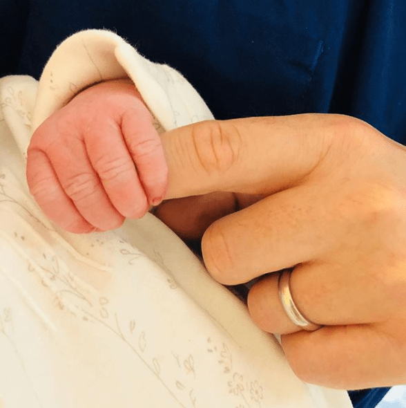 The couple shared the first picture of the baby’s hand