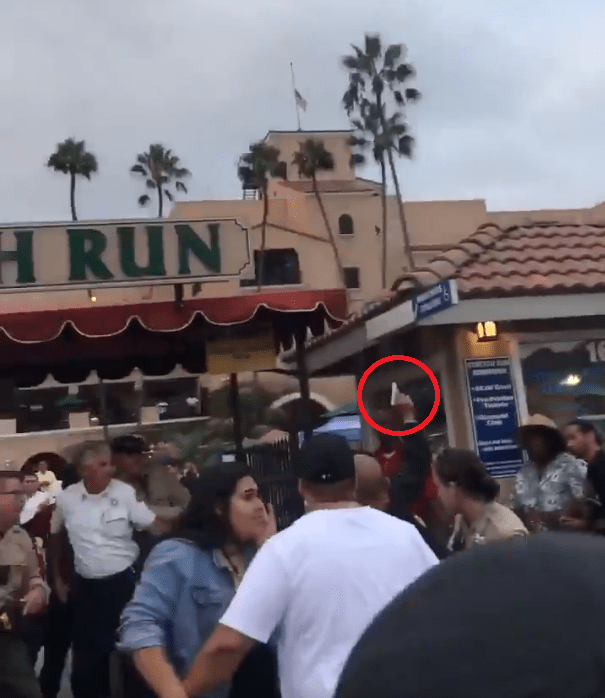  A man holds a silver gun and fires in the air, causing mass panic at Del Mar racetrack