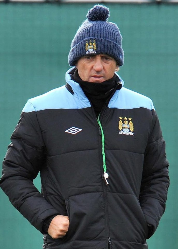 Roberto Mancini was midway through his five-year reign at the Etihad when he donned this bobble hat and whistle in 2011