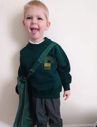  Alfie poses for a first day at school picture