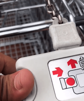  The shopper then slides the trolleys lock to trick the mechanism