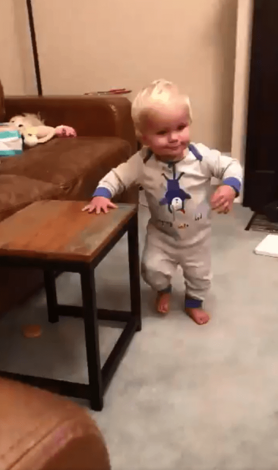  Sammy begins by standing next to a coffee table