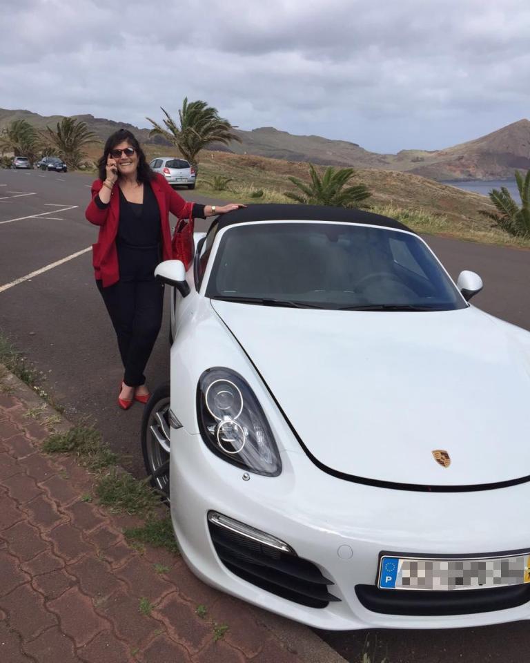  Dolores posed by a white Ferrari