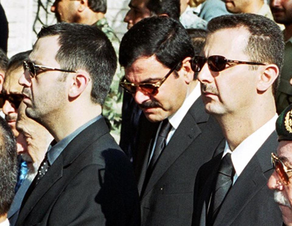  Syrian President Bashar al-Assad, right, his brother Maher, left, and brother-in-law Major General Assef Shawkat, centre, stand during the funeral of late president Hafez al-Assad in Damascus in this June 13, 2000