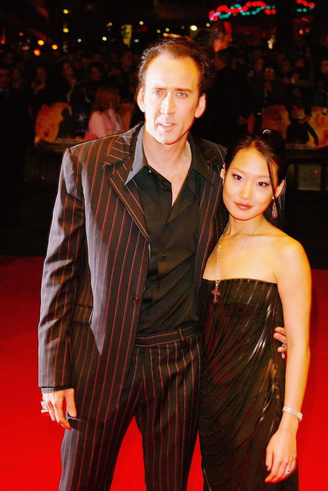  Actor Nicolas Cage and his wife Alice Kim arrive at the UK film premiere of "National Treasure"