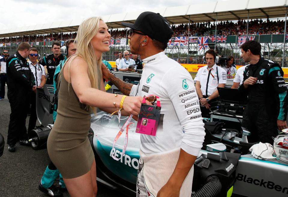 Lindsey Vonn hugs Lewis Hamilton before the British Grand Prix in 2015