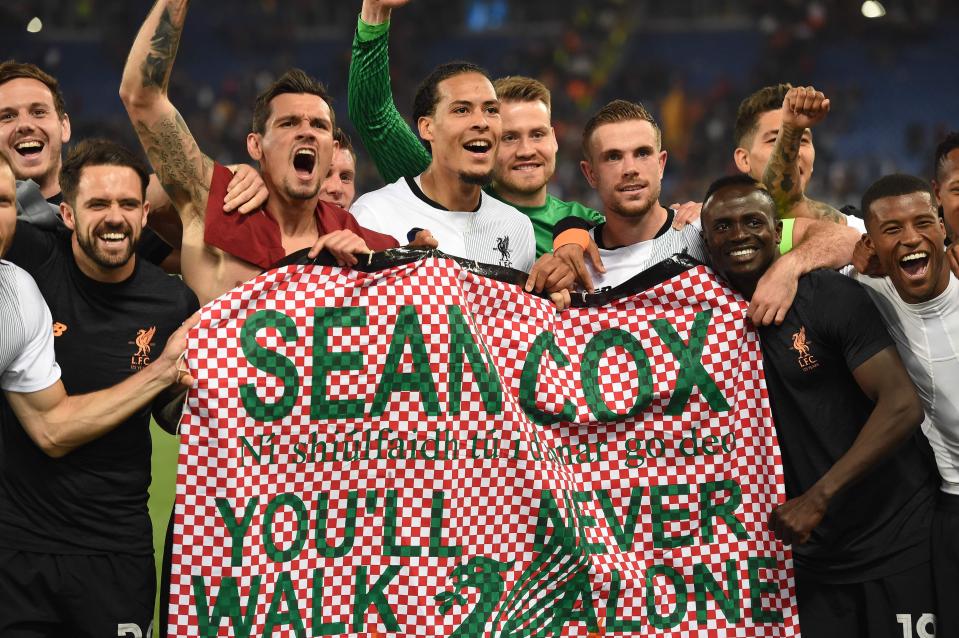  Liverpool players held up a banner in support of Cox