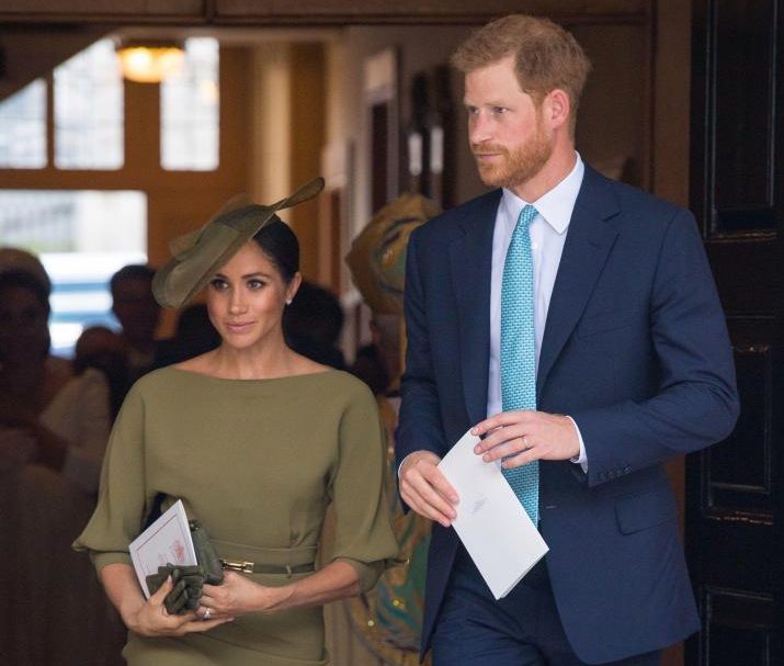  Meghan carried a pair of olive green gloves at Prince Louis' christening in July