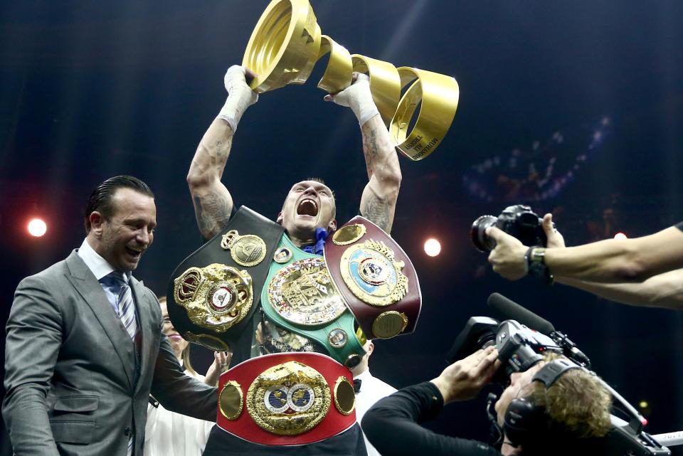  Usyk celebrates after beating Murat Gassiev to become the undisputed king back in July