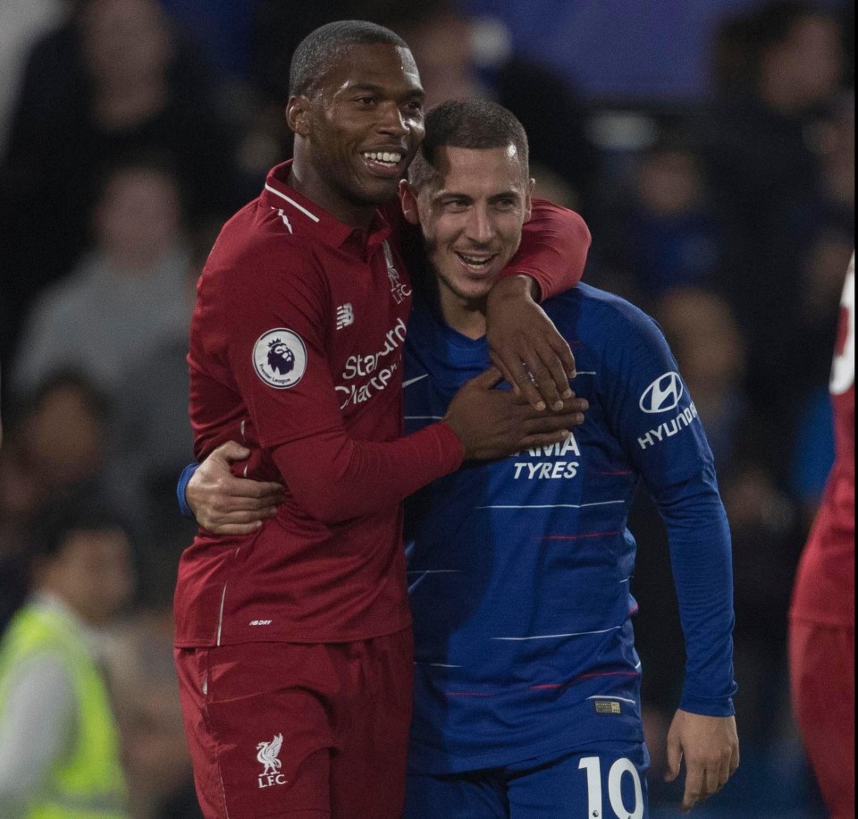 Sturridge hugs Eden Hazard after the duo both netted in the 1-1 draw on Saturday