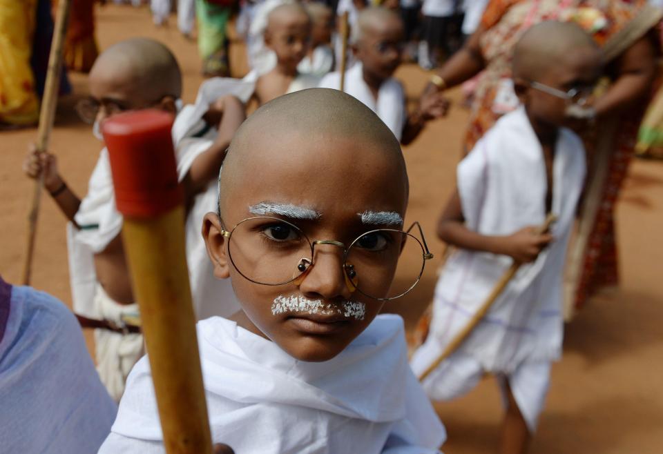  A child dressed as Gandhi