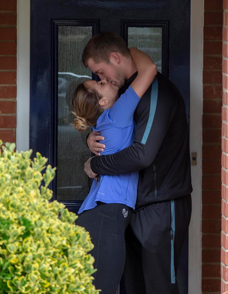  Jacqueline wrapped her arms around her hunky husband's neck as they kissed