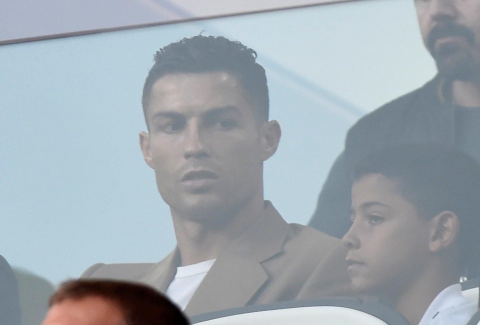 Ronaldo, 33, with his family as they watch Juve take on Young Boys