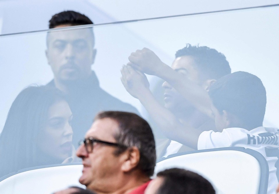 Ronaldo’s son flings his arms in the air during the Group H clash. His family have remained at his side during the rape claim storm