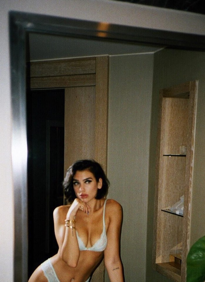 DUA Lipa strikes a thoughtful pose, maybe wondering where her clothes have gone