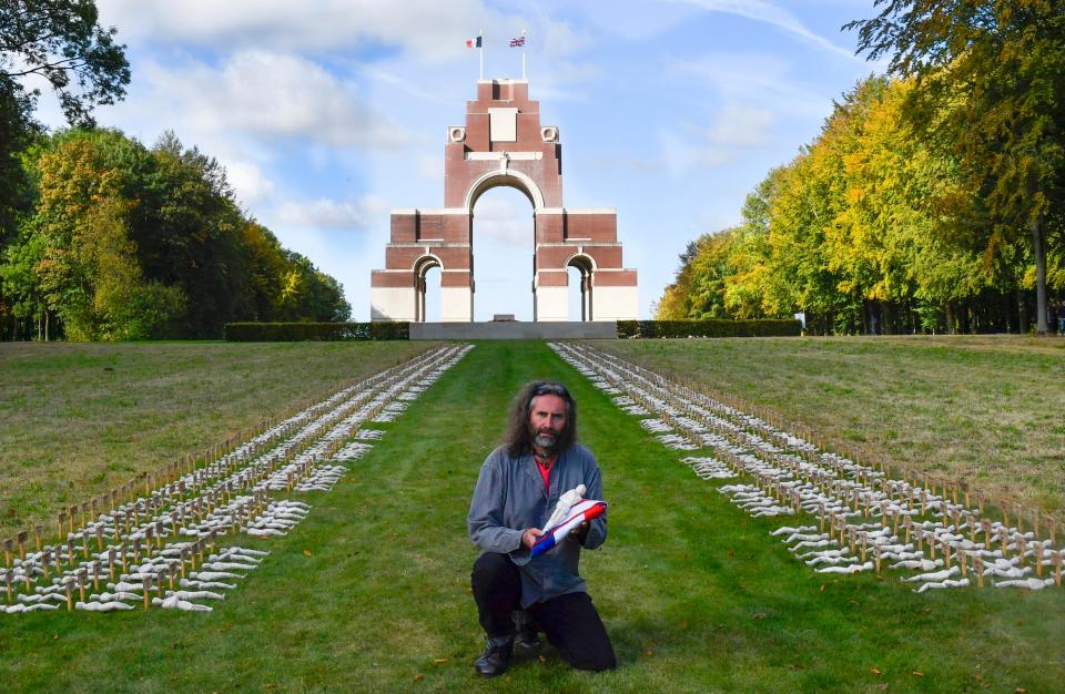  Rob lays some of his Shrouds of the Somme figures at the Thiepval memorial France