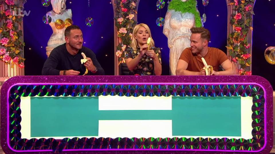  Holly's teammates, Will Mellor and Olly Murs, watched on in shock 