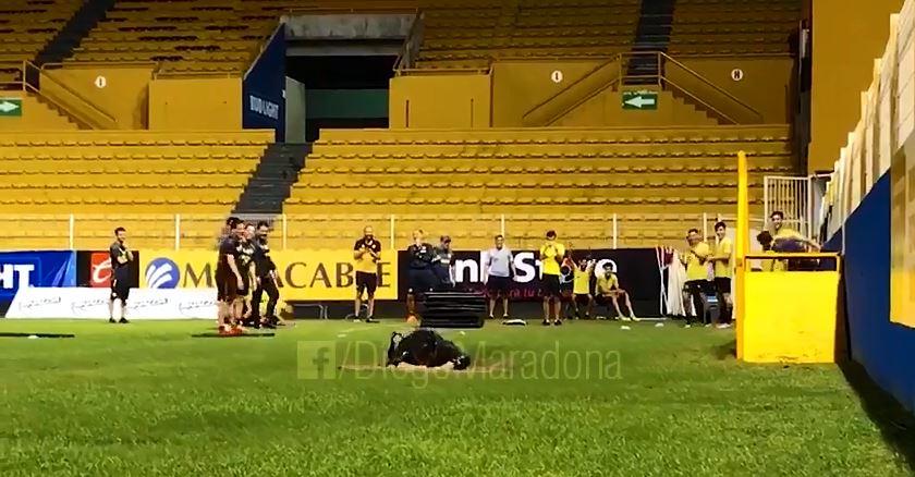  Maradona completes his belly dive much to the amusement of the squad