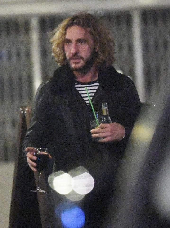  Seann was spotted with a glass of red wine