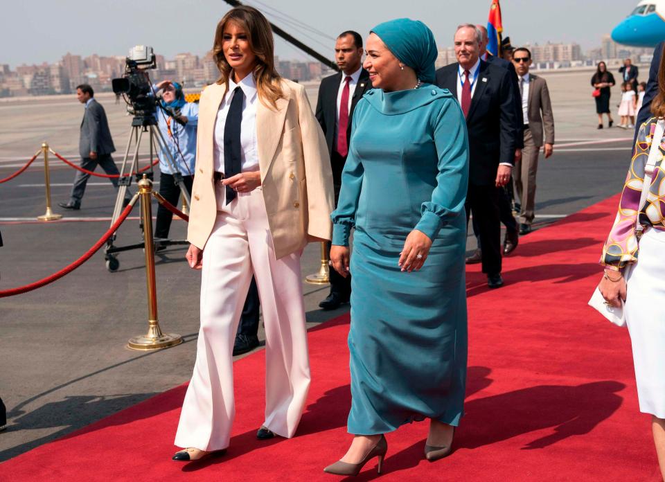  The First Lady walking with her Egyptian counterpart Intissar Amer upon arrival in Cairo