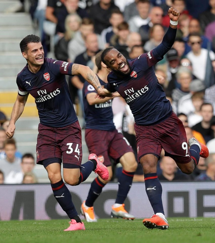  Lacazette celebrates his first goal with Granit Xhaka