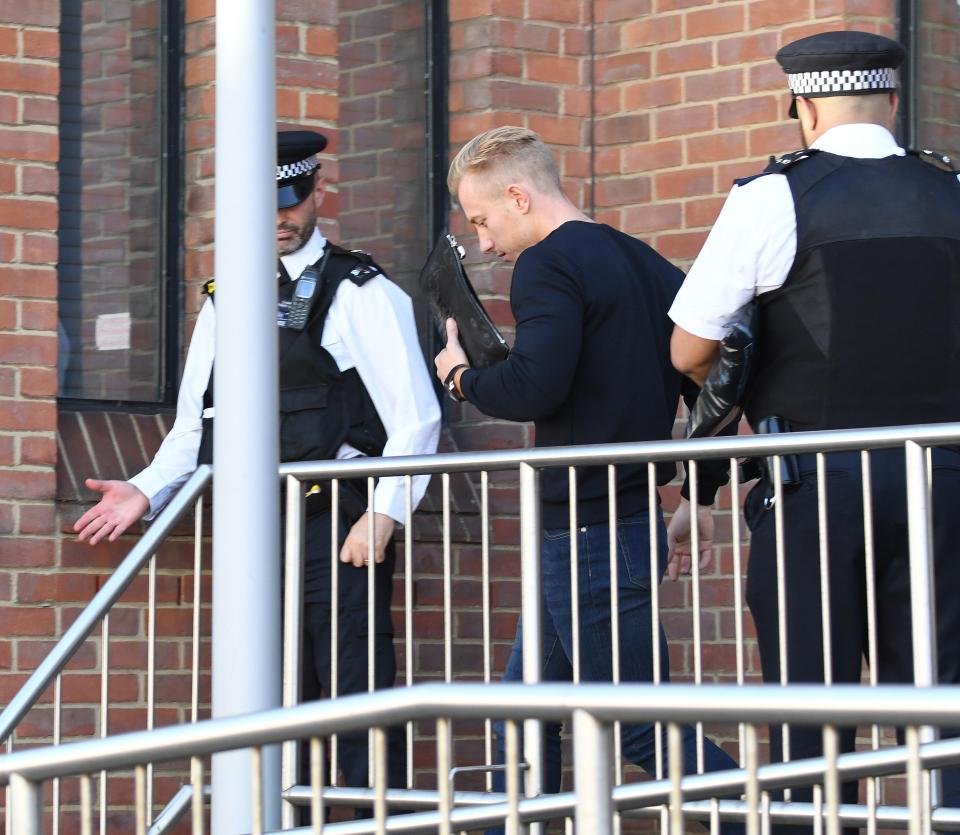  Boyson leaving the station accompanied by police