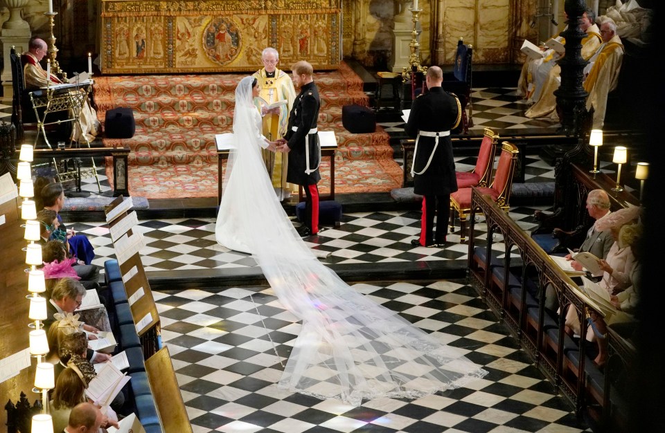 Her jaw-dropping 15ft embroidered veil lined the aisle of St George’s Chapel, where Eugenie and Jack wed today