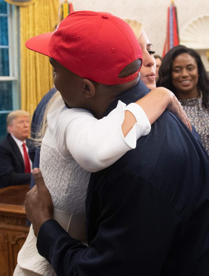  Above: Rapper Kanye West also hugged Ivanka Trump