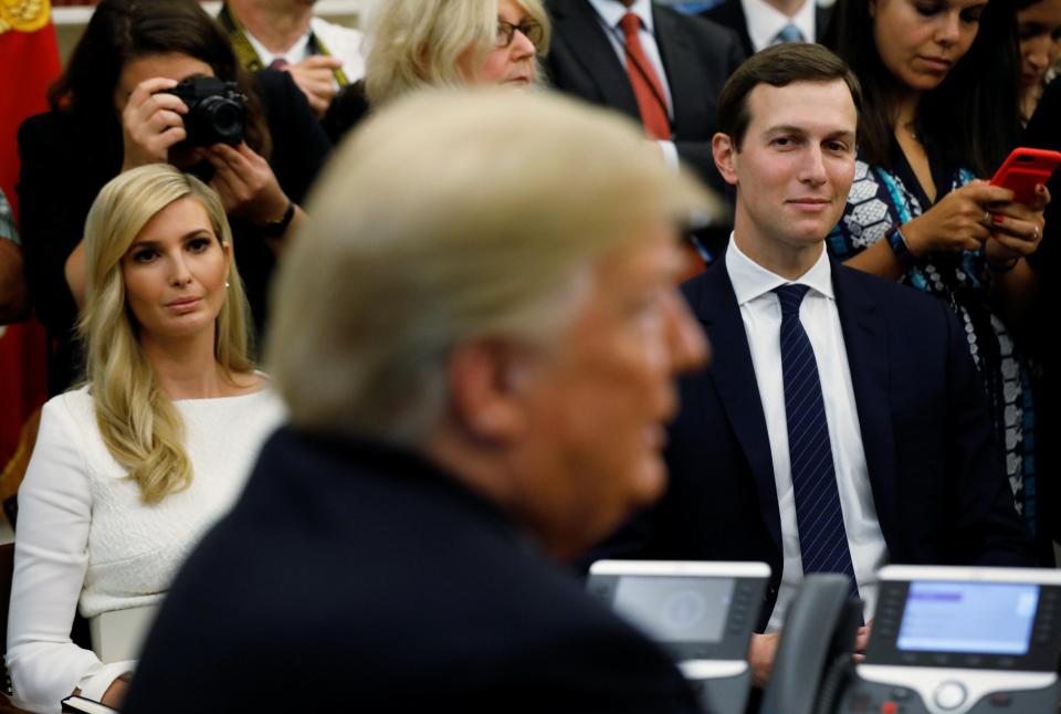  President Donald Trump meets with rapper Kanye West in the Oval Office of the White House, watched by Ivanka Trump and Jared Kushner