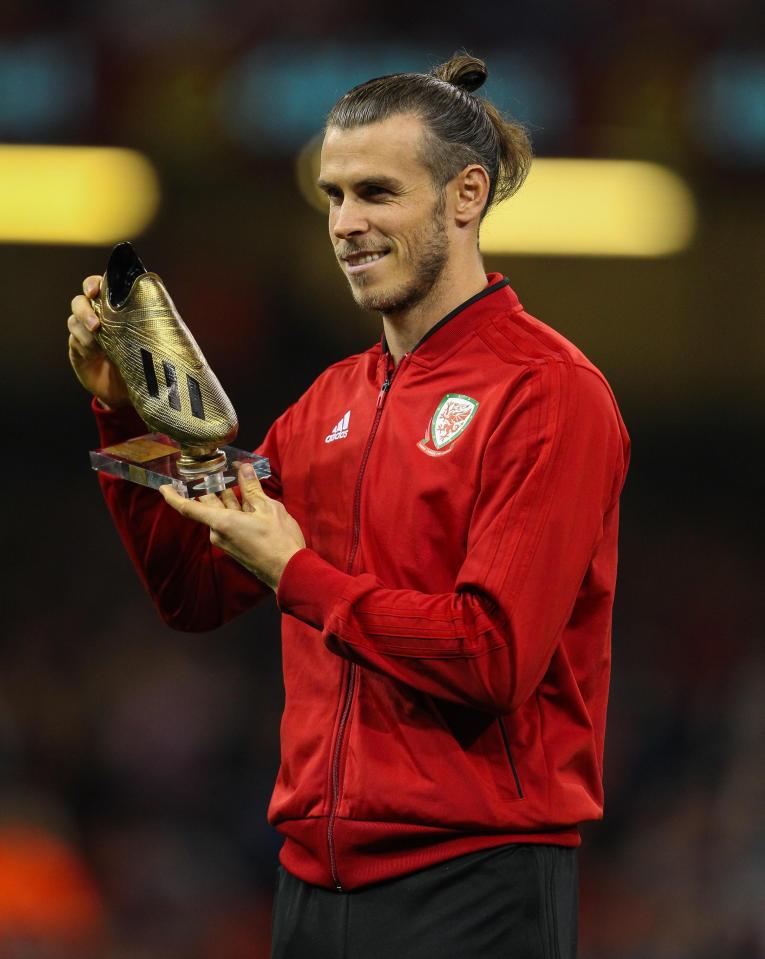  Gareth Bale is presented with a Golden Boot before Spain game for breaking Ian Rush's record goal tally for Wales