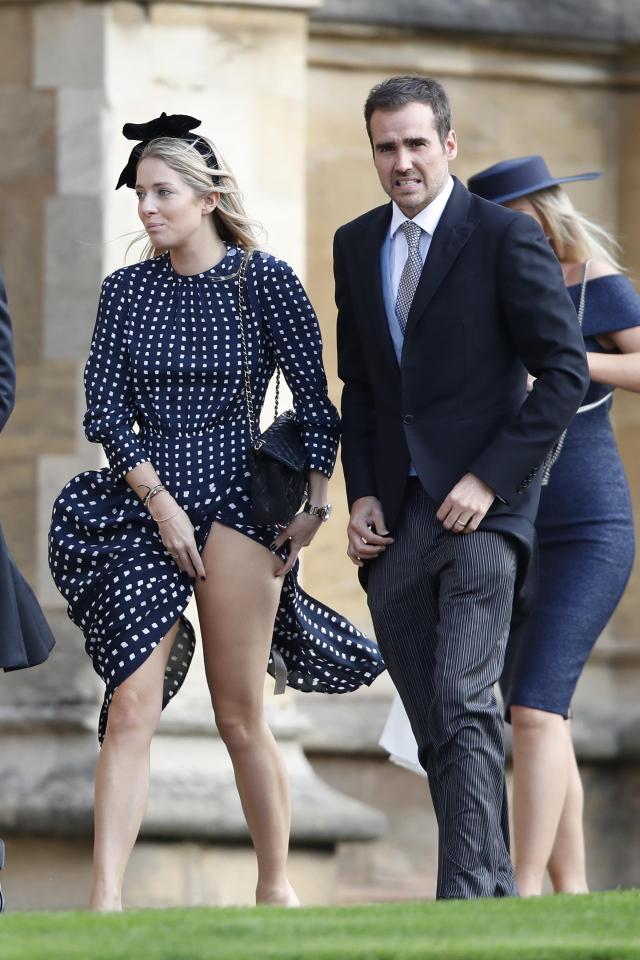  A woman pulled down her dress after it was caught in the wind