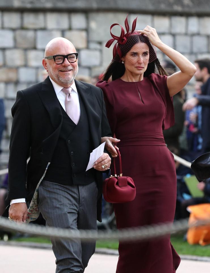  Demi Moore wore burgundy for the royal wedding, complete with a fascinator