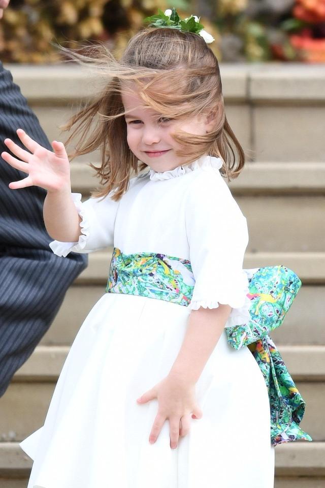  Cheeky Princess Charlotte waves as she arrives as flower girl