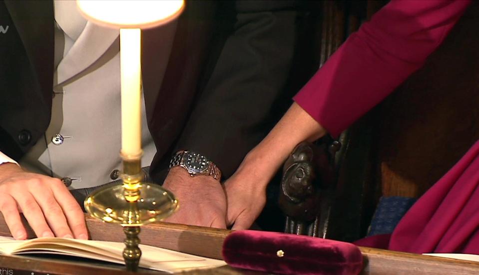  William held Kate's hand as she put it on his knee