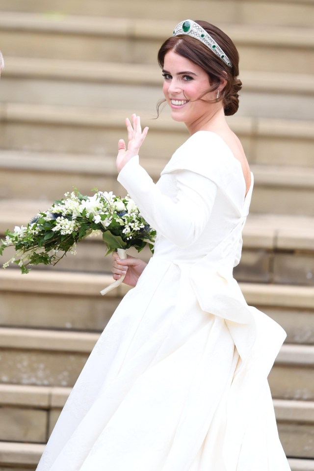 The low-backed gown was designed to show Eugenie’s scars from her childhood operation to fix the curvature in her spine