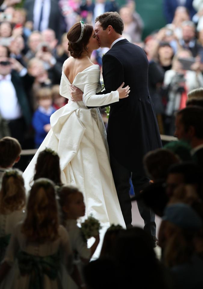  Crowds cheered as the newlyweds as they kissed as man and wife