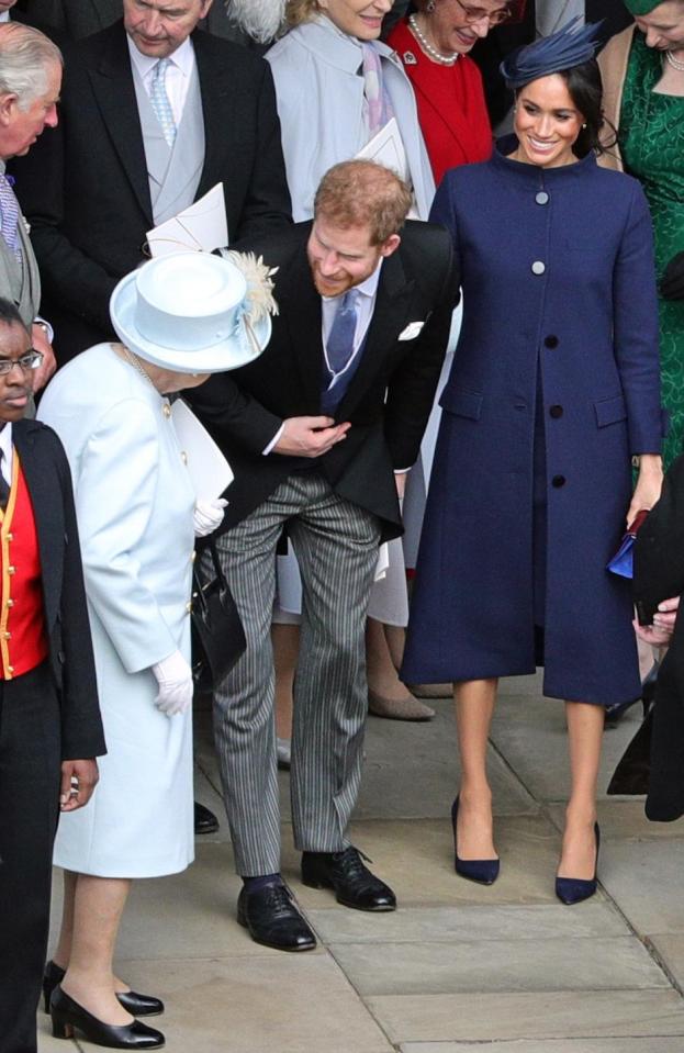  Meghan wore a large blue coat for the wedding of Princess Eugenie - sending the rumour mill into overdrive