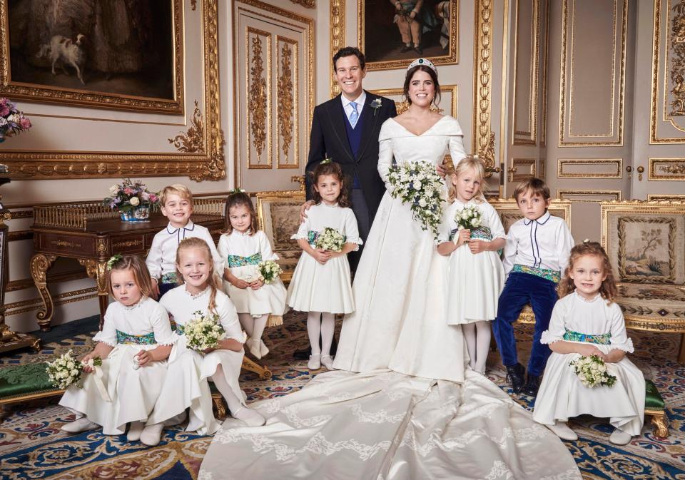  Eugenie and Jack beam as they pose with their bridesmaids and page boys