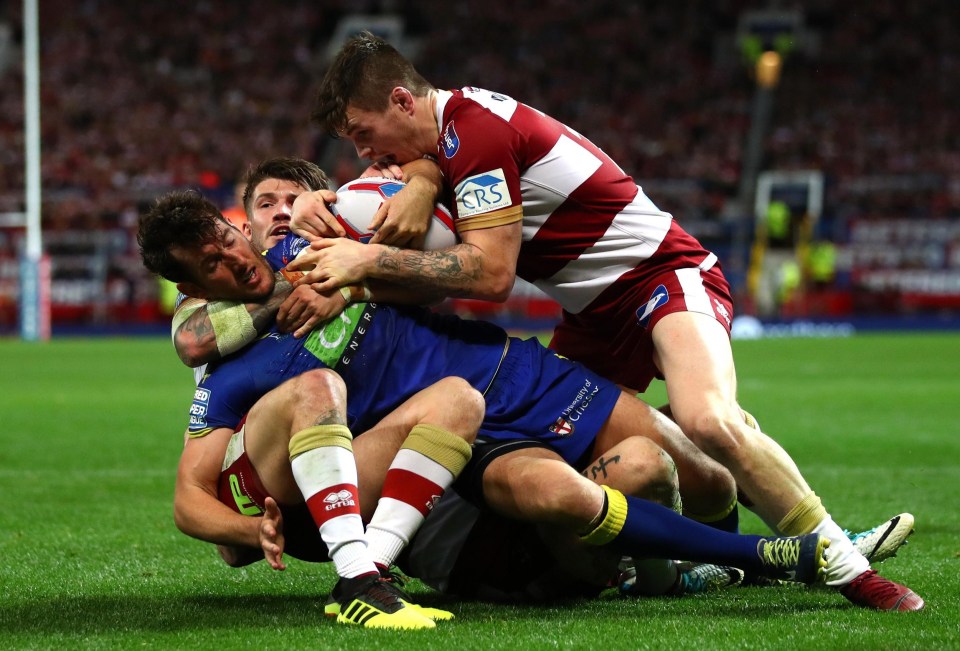 Wolves ace Stefan Ratchford is tackled as his side succumb to Wigan at Old Trafford