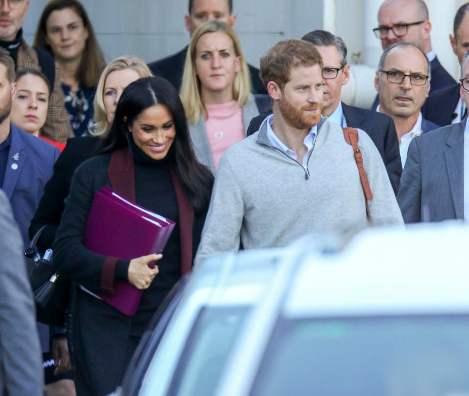  The couple held hands as they were whisked through the airport