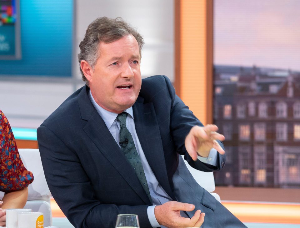  Piers Morgan has sparked a heated debate on Twitter over a photo of Daniel Craig using a papoose to carry his child