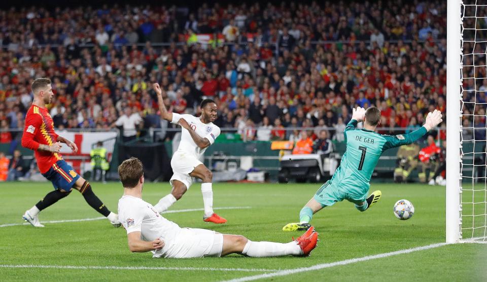  Raheem Sterling sweeps home England's third before the break